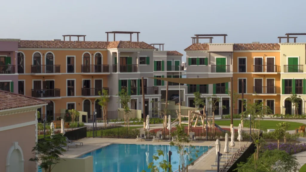 Sur La Mer townhouses around a landscaped courtyard with swimming pool