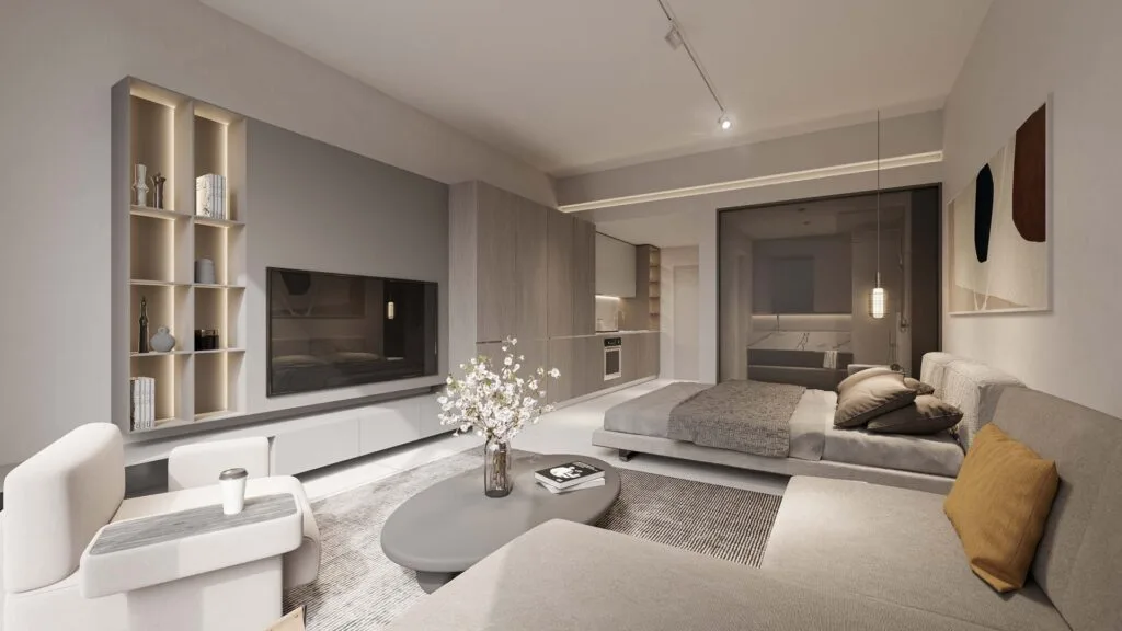 Modern studio apartment interior with bed, sofa, and kitchen
