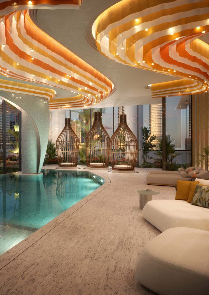 Indoor spa room with massage tables and pool area with seating
