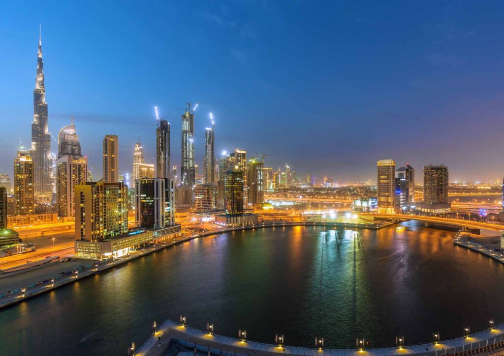 Night view of Dubai Creek Harbour skyline near The One at Jumeirah Village Triangle in Jumeirah Village Triangle