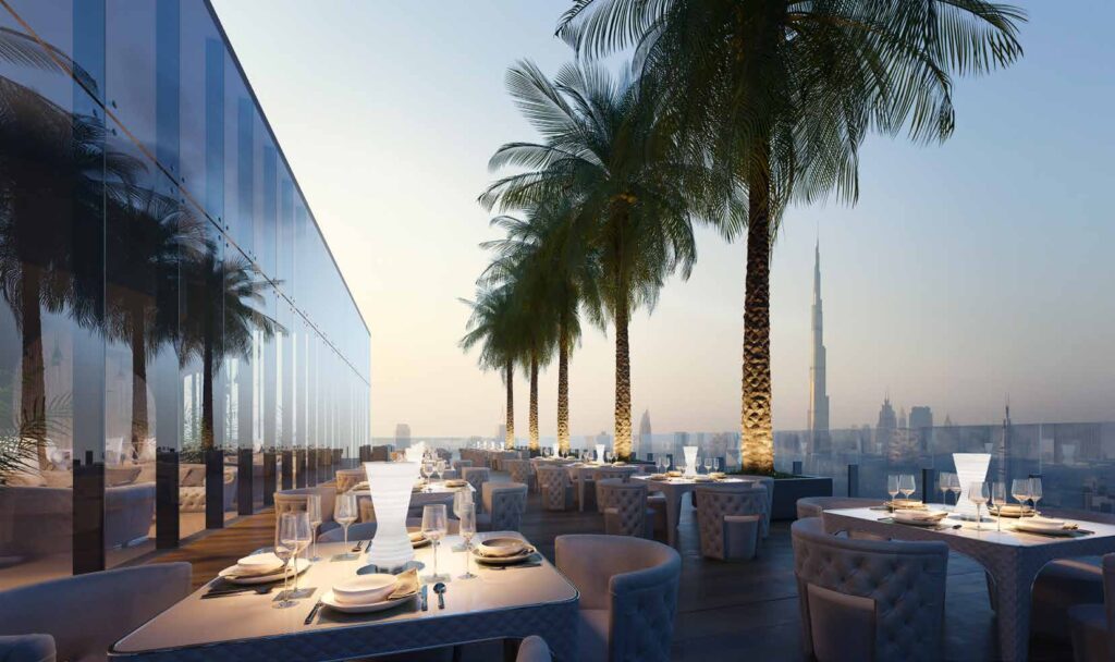 Outdoor dining terrace with city view at The One Jumeirah Village Triangle Dubai