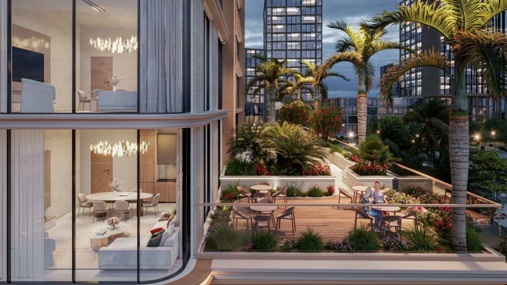 Outdoor terrace with tables and palm trees near modern residential buildings