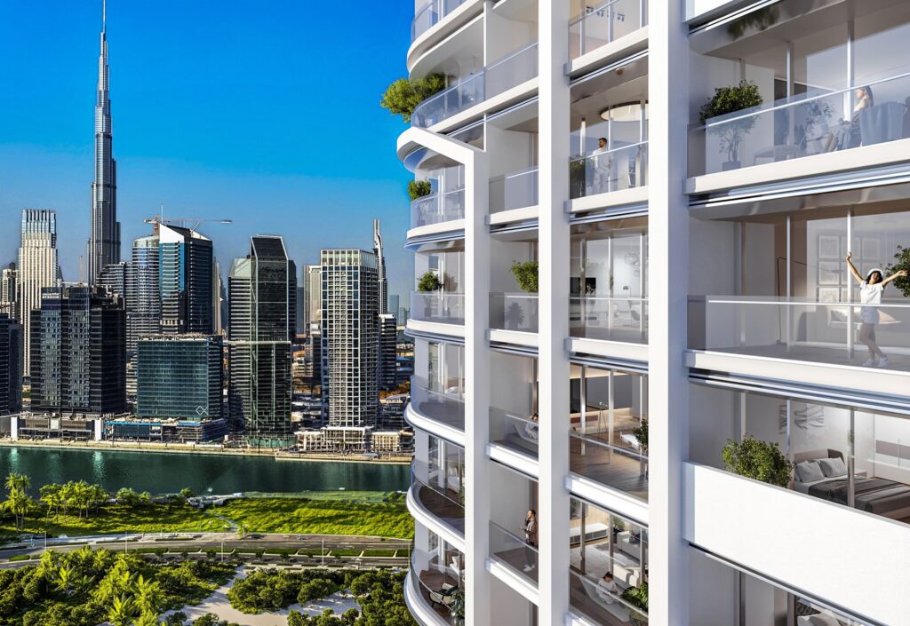 Exterior view of high-rise residential building with Dubai skyline
