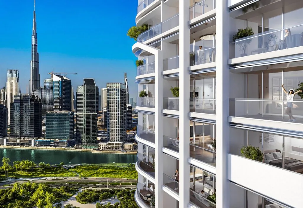 Exterior view of high-rise residential building with Dubai skyline