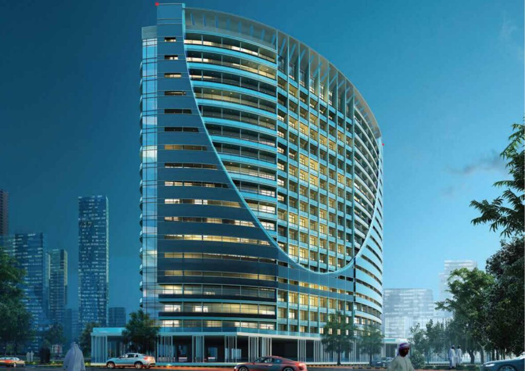 Curved glass facade high-rise building at dusk