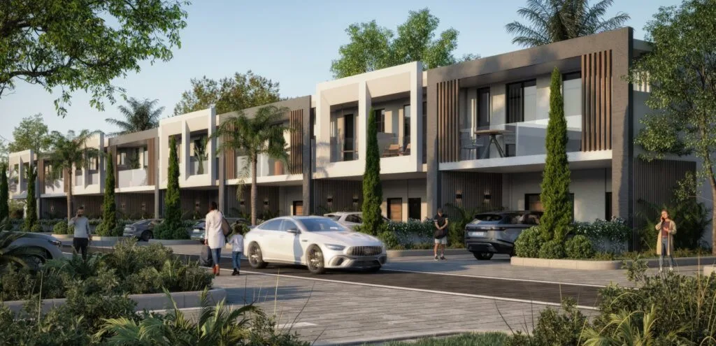 Exterior view of modern townhouses with parked cars and trees