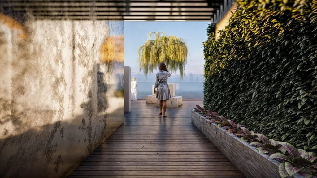 Outdoor wooden deck with plants and a tree in the distance