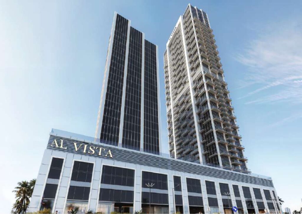 Two tall modern residential towers with glass facades