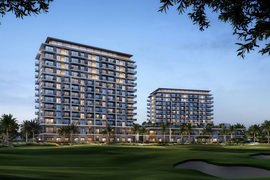 Two mid-rise residential buildings with balconies near a golf course